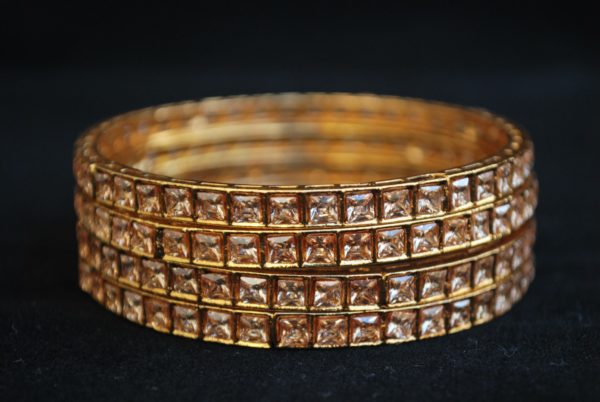 Imitation artificial jewellery gold colour cz copper based bangle