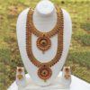 South Indian bridal jewellery set in copper with red stones
