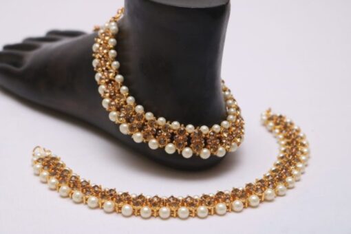 Golden stone studded pearl bridal anklet