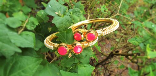 Pink stone studded golden bangles kada style